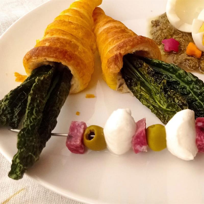 Puff pastry carrots with bean mousse with truffle and black cabbage